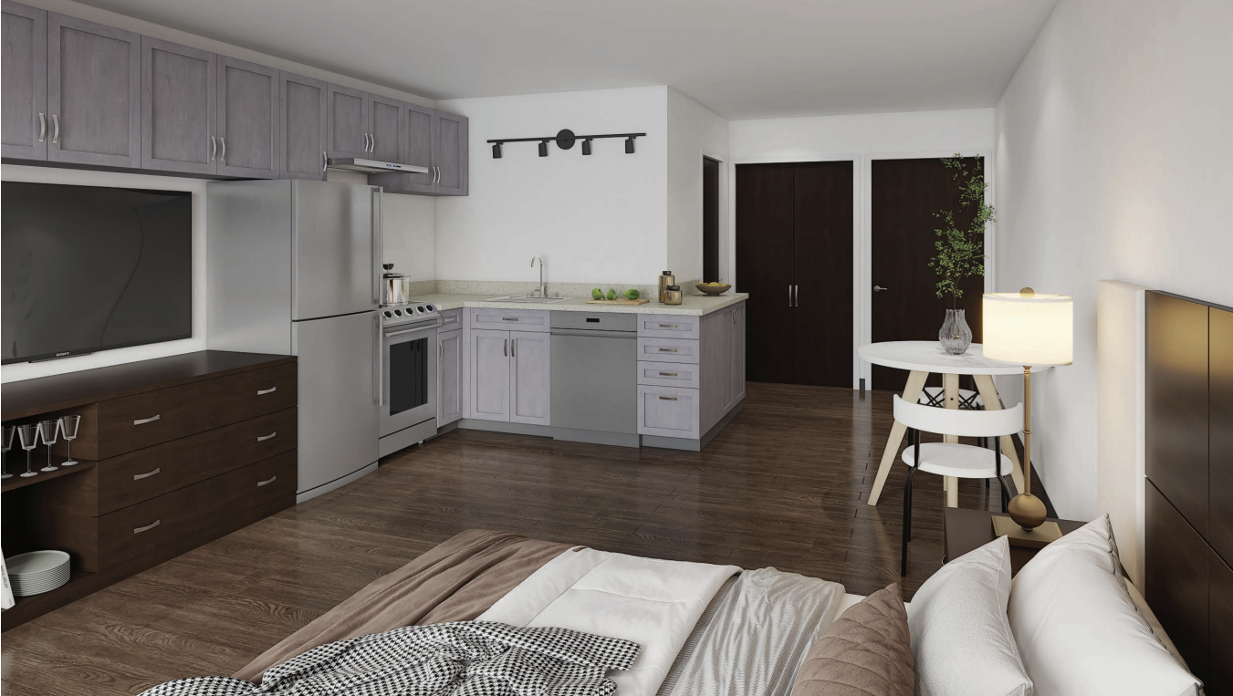 A modern kitchen with a refrigerator, oven, and cabinets.